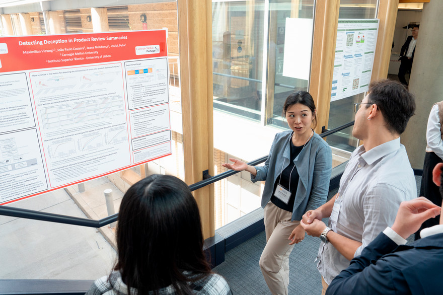 students discussing a poster