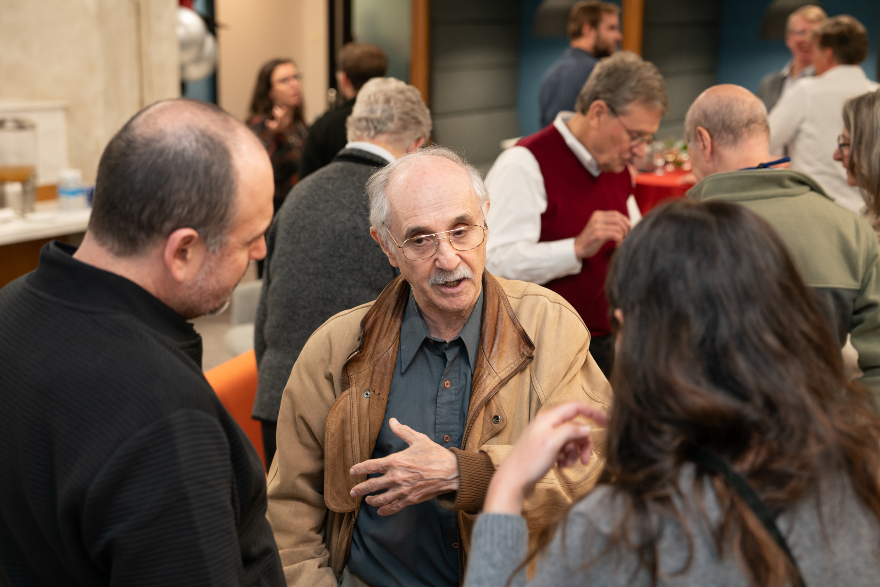 ed rubin, current, speaks with colleagues