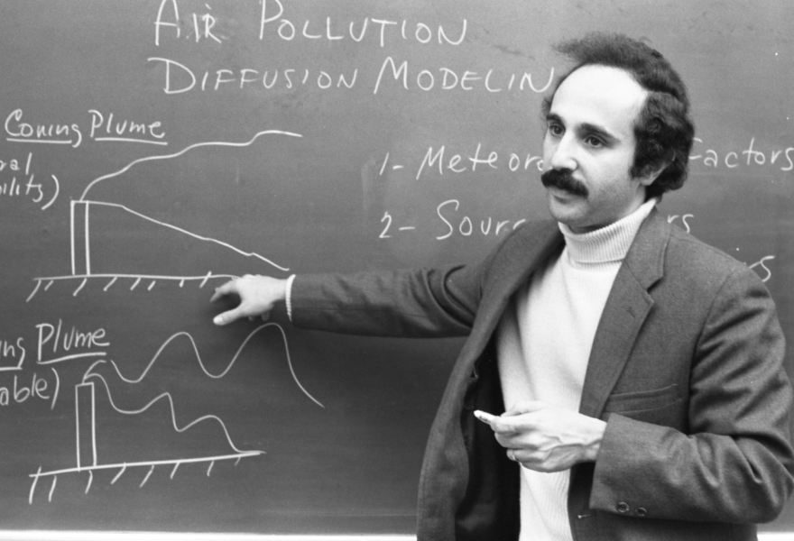 ed teaches at a blackboard